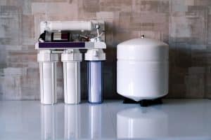 Reverse osmosis water purification system at home. Installed water purification filters. Clear water concept